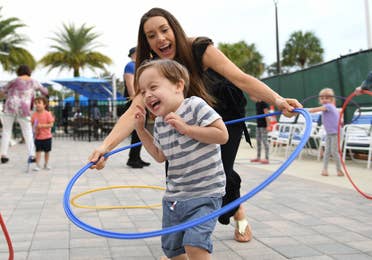 Children hula-hooping at Orange Lake Resort near Orlando, Florida.