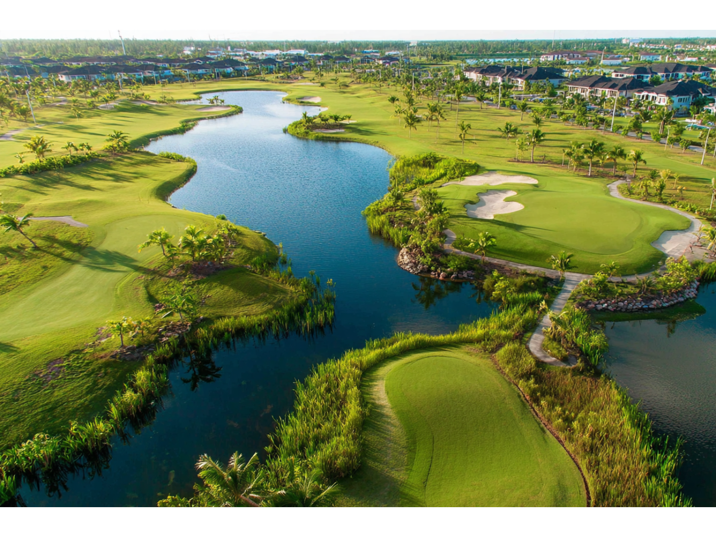 Lush golf course in Marco Island, Florida, surrounded by palm trees and scenic views.