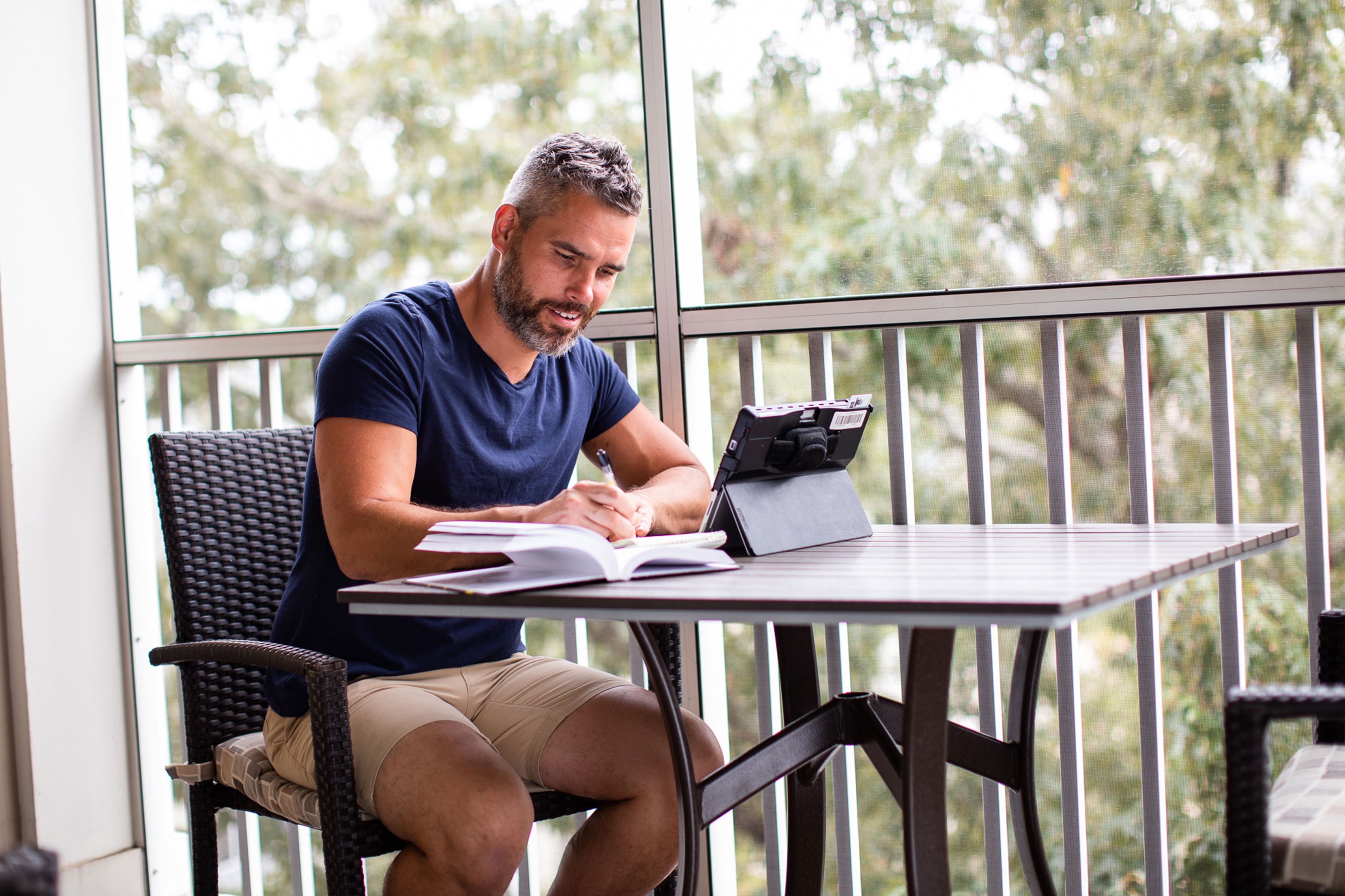 Brenda Rivera Sterns' husband, Isaiah, works remotely on the patio of our Signature Collection villa at our South Beach Resort in Myrtle Beach, South Carolina.