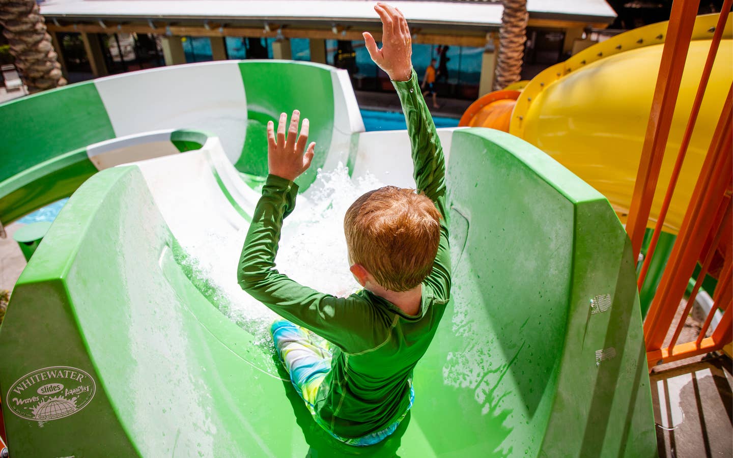 Child going down waterslide in Splash Canyon at Scottsdale Resort.