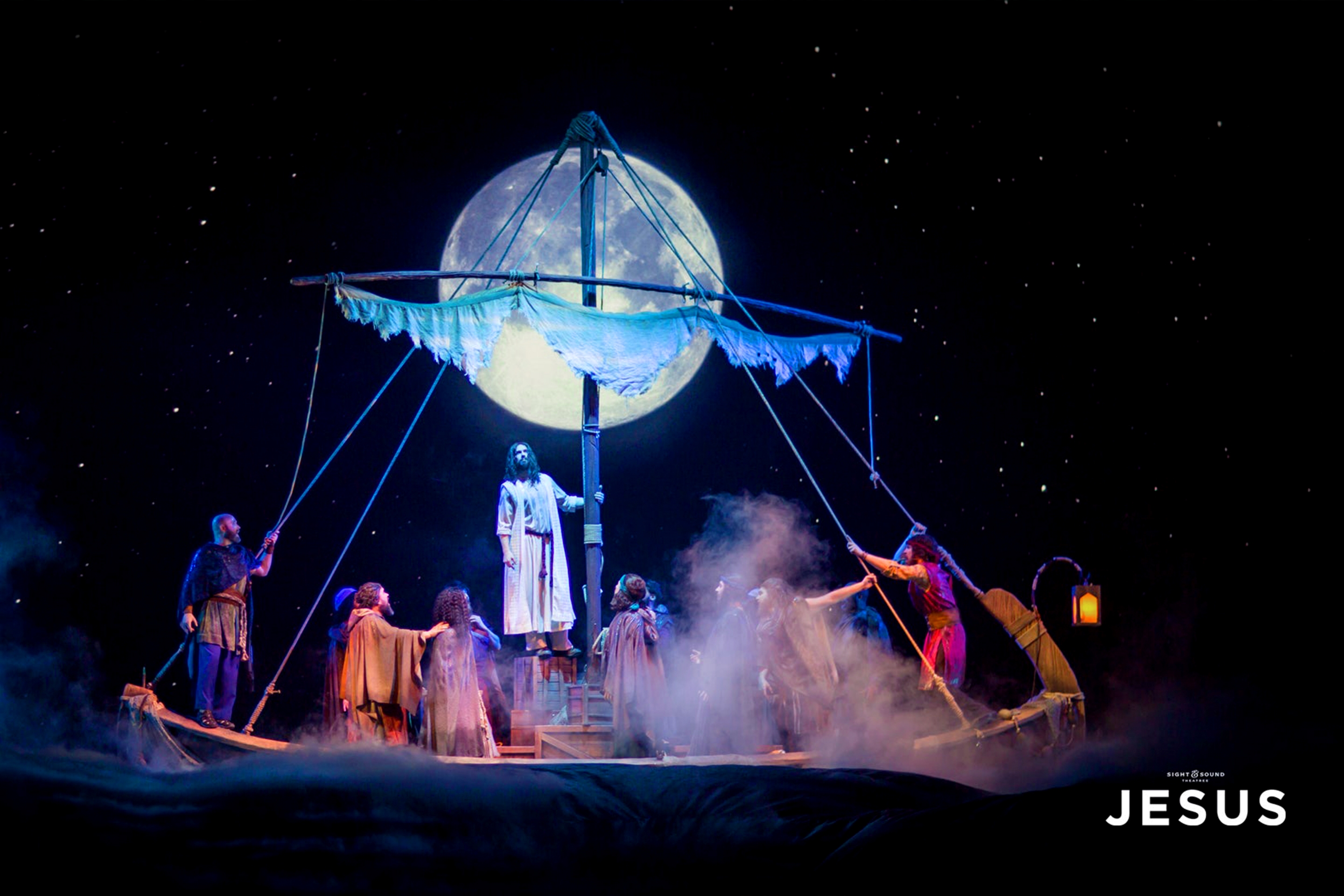 Stage performer on a stage set portraying biblical characters.