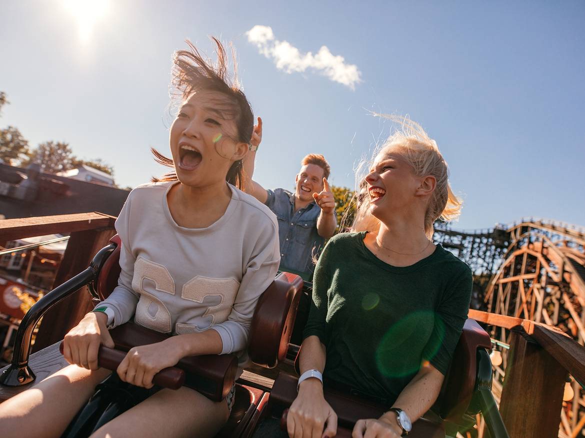 People riding rollercoaster