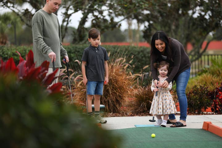 Family playing mini golf at Orange Lake Resort near Orlando, Florida