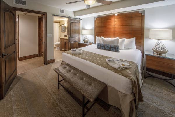 King bedroom with attached bathroom in a signature one-bedroom villa at Scottsdale Resort