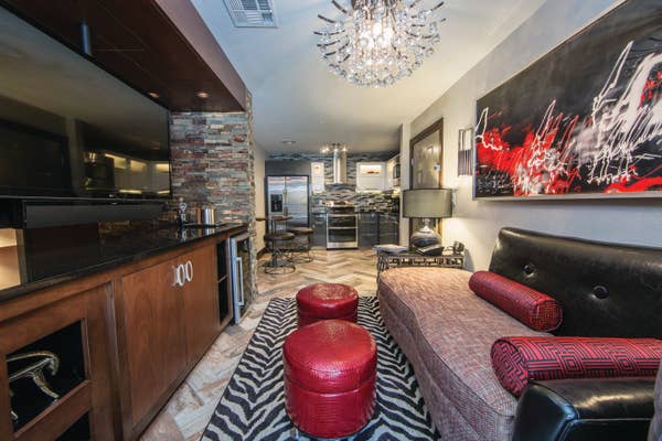 Living room and kitchen in a studio Signature Villa at Desert Club Resort in Las Vegas