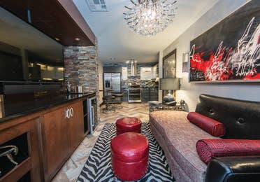 Living room and kitchen in a studio Signature Villa at Desert Club Resort in Las Vegas
