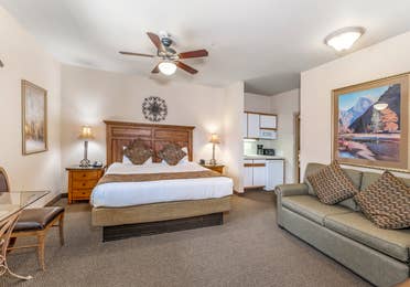 Bed and living area in a Ridge Pointe villa at Tahoe Ridge Resort