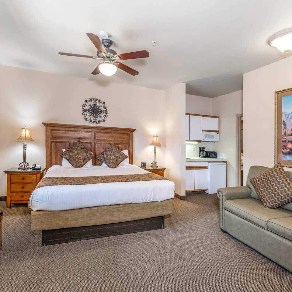 Bed and living area in a Ridge Pointe villa at Tahoe Ridge Resort