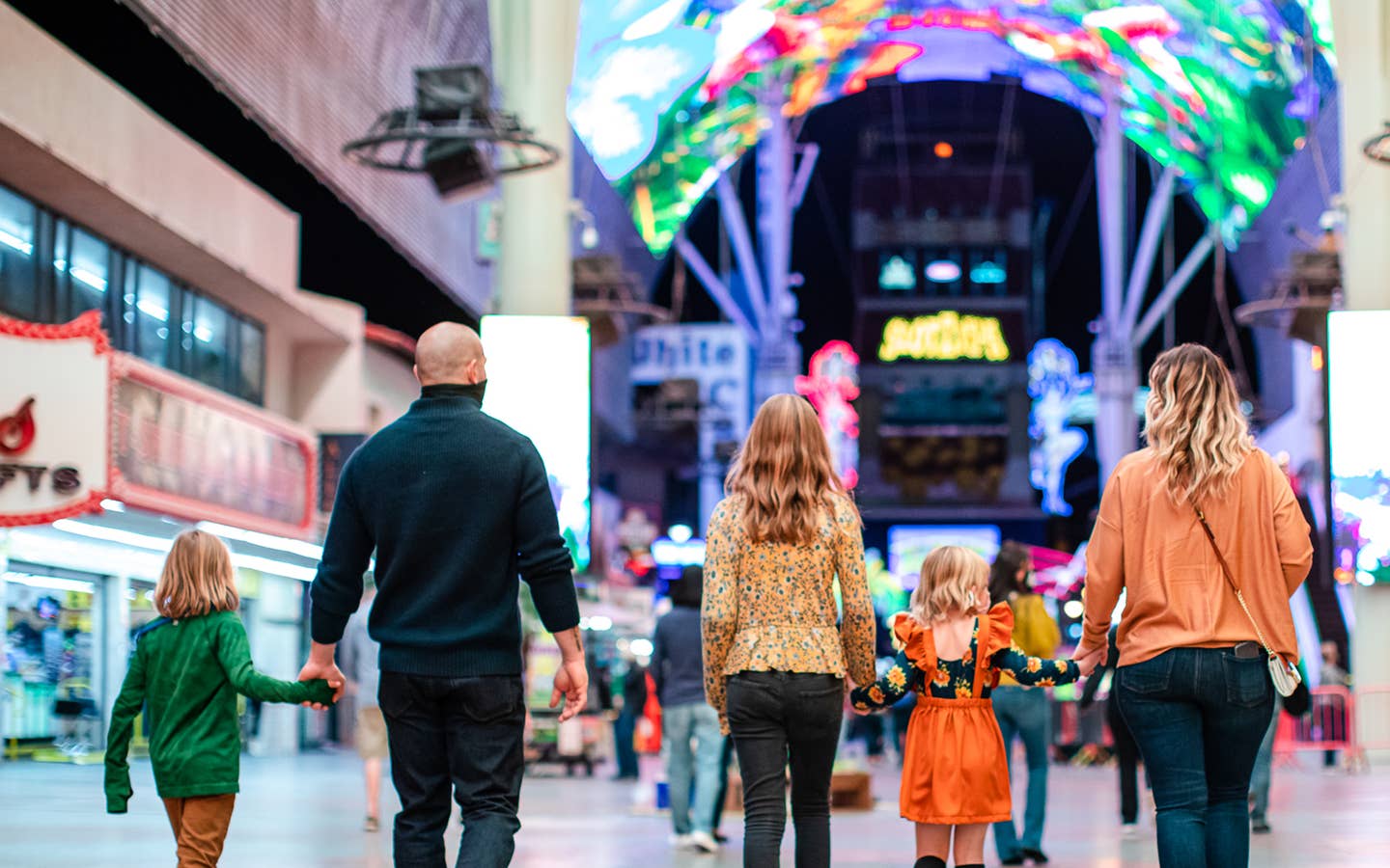 The Haby family walk down Fremont street near our Desert Club Resort located in Las Vegas, Nevada.