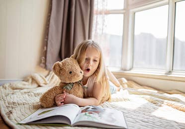 Girl reading a book.