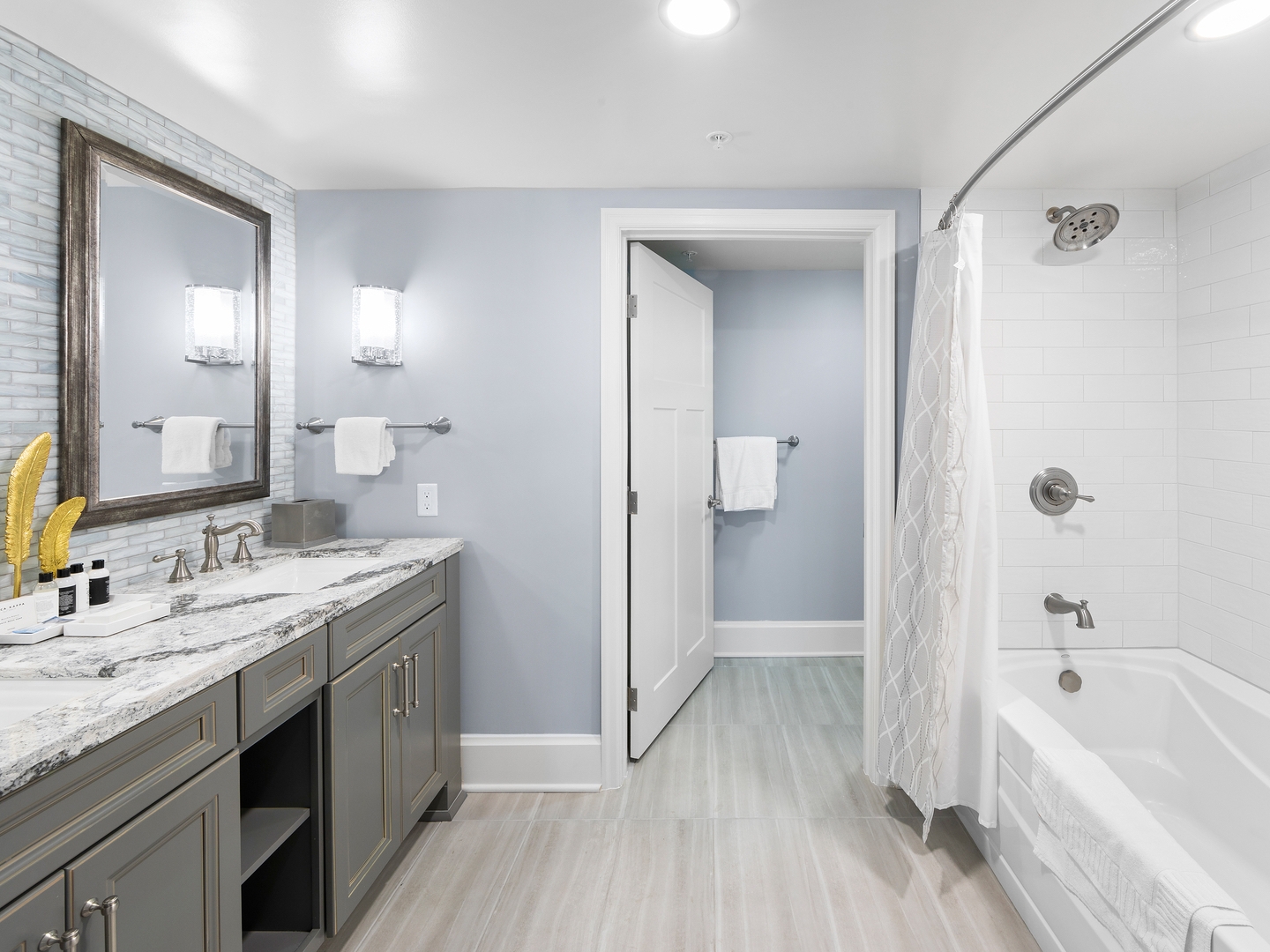Bathroom with shower/tub combination in a four-bedroom Signature Collection villa at Cape Canaveral Resort.