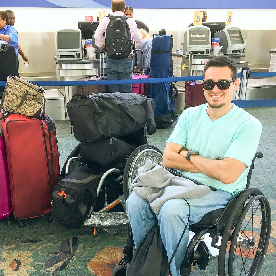 Danny at the airport next to all his luggage