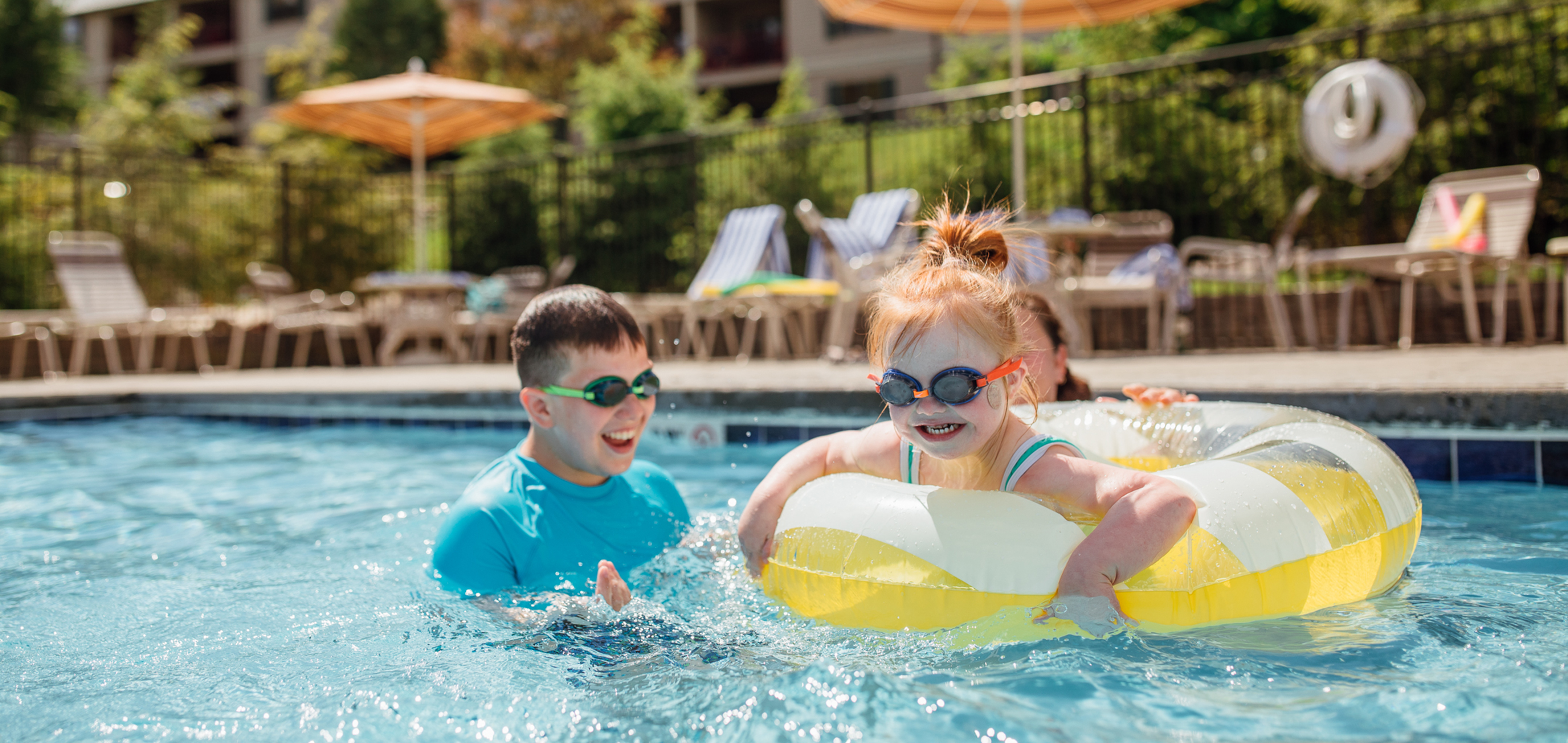 Kids swimming in outdoor pool at Oak n' Spruce Resort in South Lee, Massachusetts.
