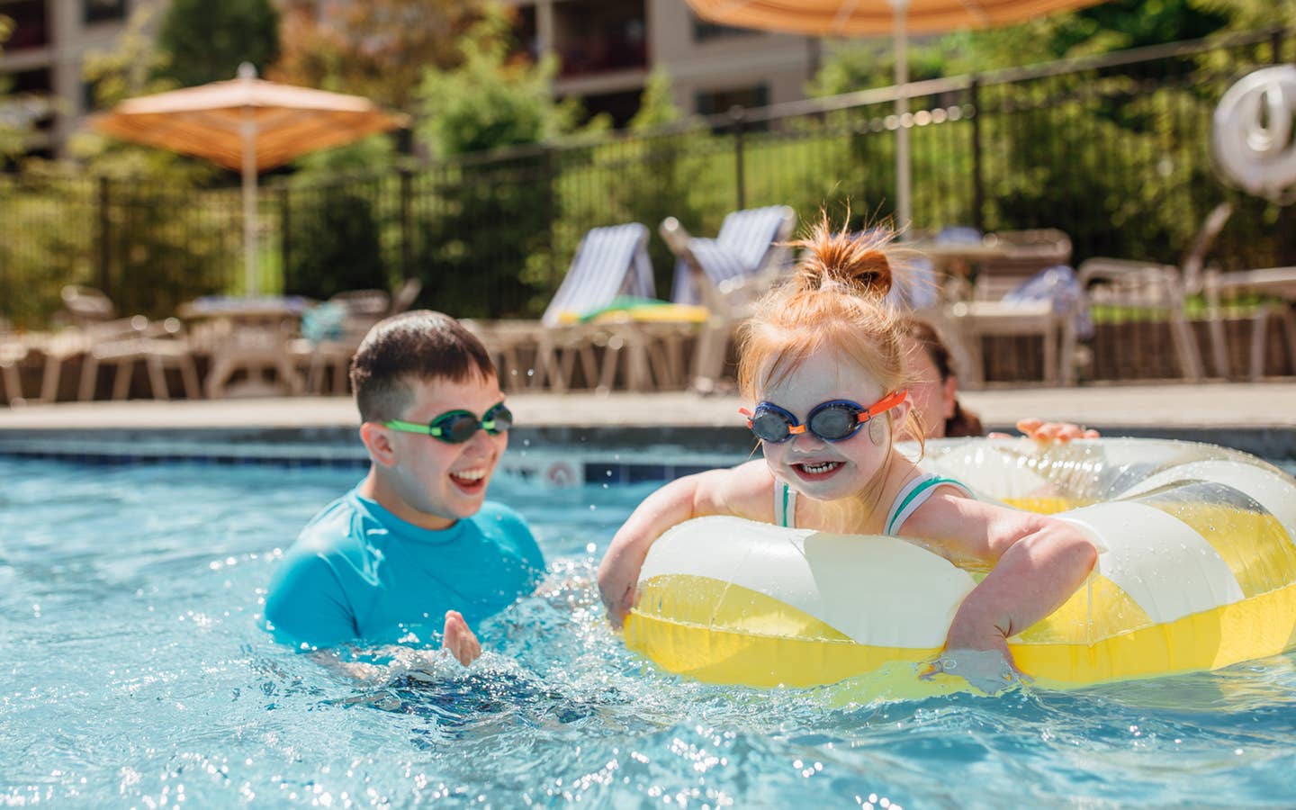 Kids swimming in outdoor pool at Oak n' Spruce Resort in South Lee, Massachusetts.