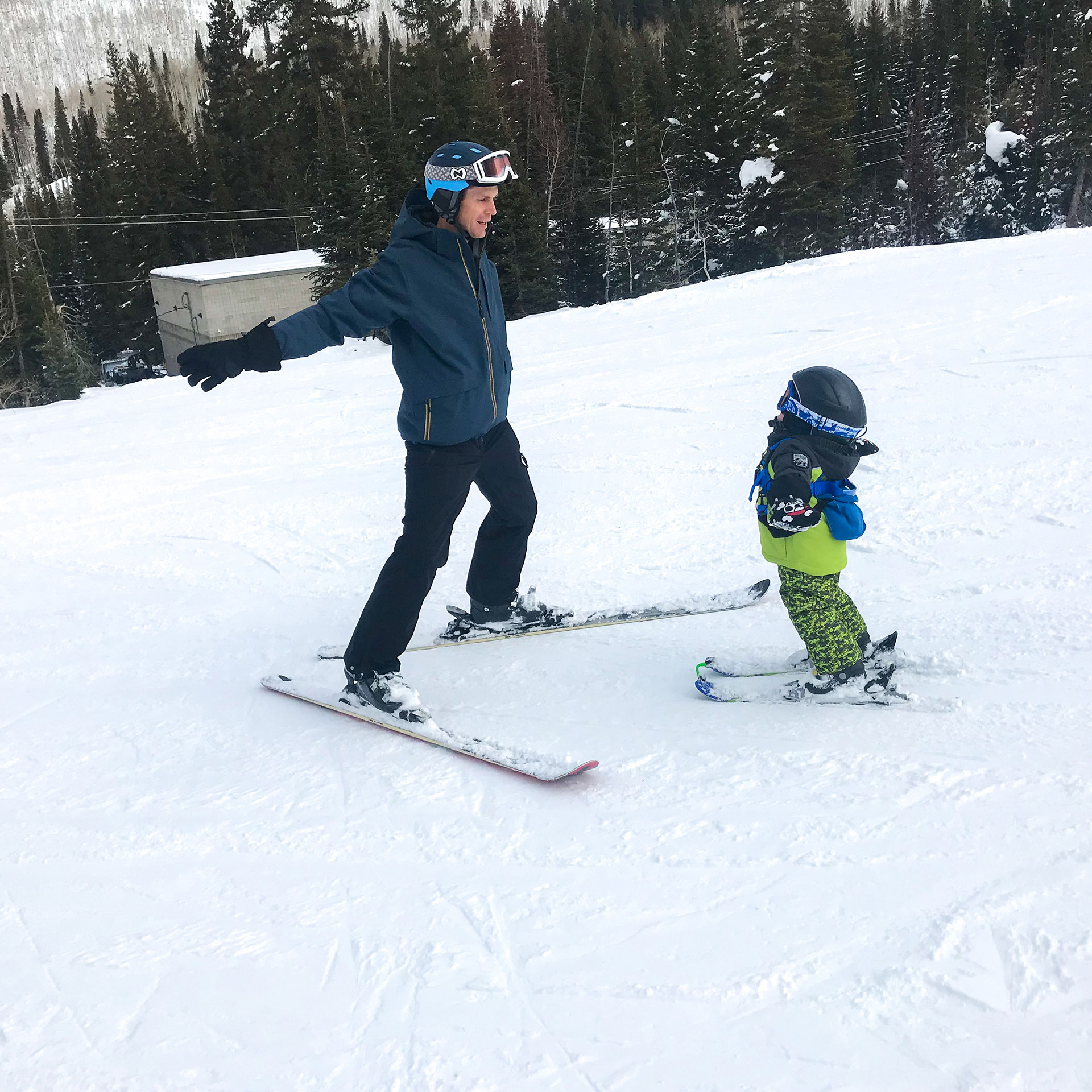 Featured Contributor, Jessica Averett's husband teaches Emmett the fundamentals of skiing.