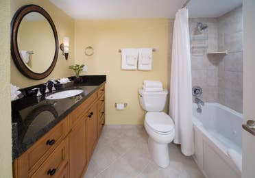Bathroom with shower/tub combination in a studio room in West Village at Orange Lake Resort near Orlando, FL