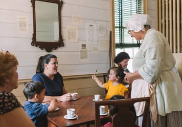 Featured Contributor, Angelica Kajiwara (left), and her family enjoy the dining experience in Williamsburg, Virginia.