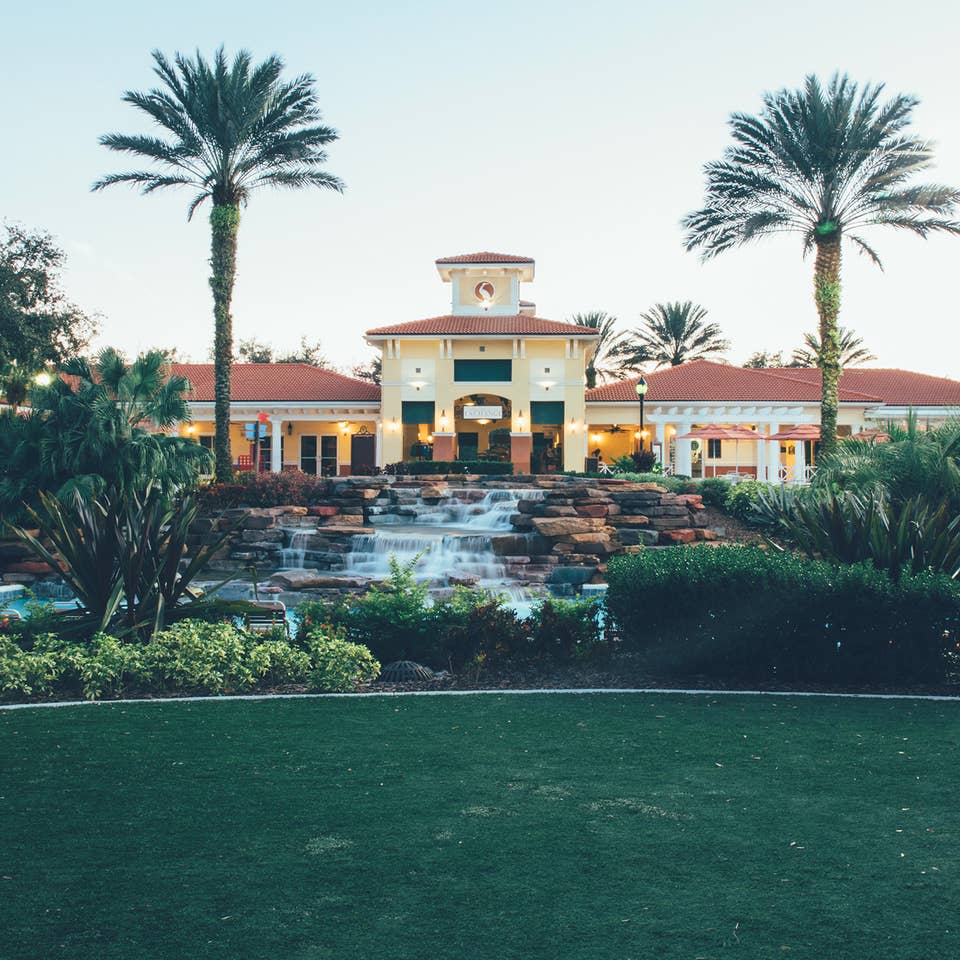 View of lazy river and The Exchange at night in River Island at Orange Lake Resort near Orlando, Florida
