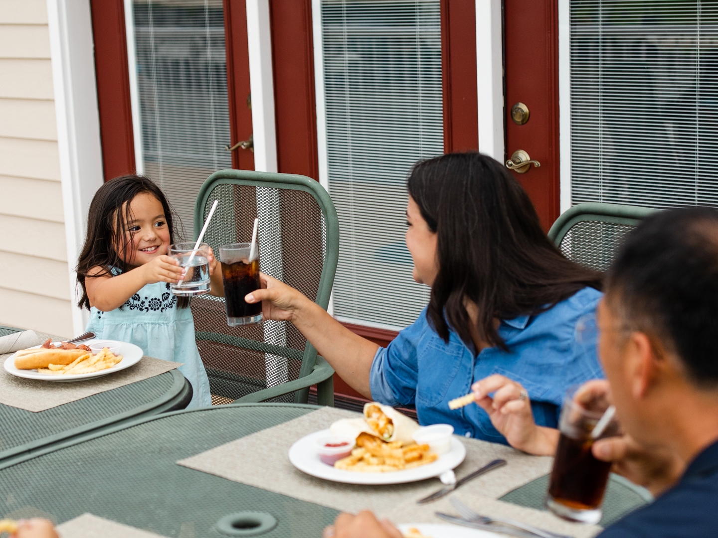 Family eating outdoors at Holiday Hills Resort in Branson, Missouri.