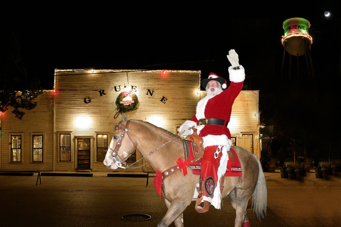 Cowboy Kringle wears a cowboy hat and red suit while riding a horse and waving to guests.