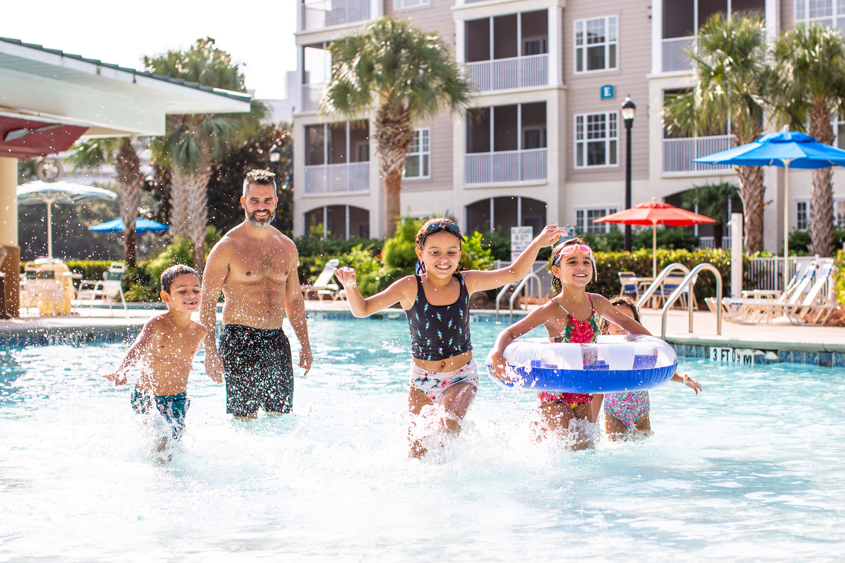 Brenda's family exits the pool with a big splash outside of the South Beach Resort.