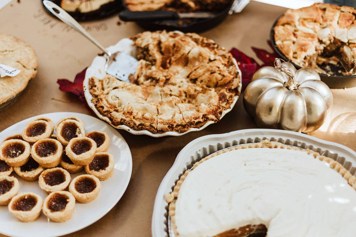 A festive fall table adorned with various pastries and desserts.