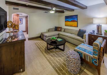 Living room with sectional sofa and southwestern style decor in a Two-Bedroom Signature Collection villa at Scottsdale Resort in Arizona