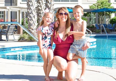 Featured contributor, Brianna Steele (middle), and her two children pose near our pool at South Beach Resort in Myrtle Beach, SC.