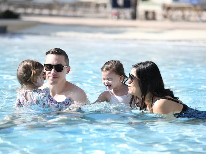Family in the pool at Orlando Breeze Resort 