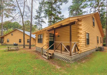 View of two cabin properties at the Lake O' the Wood Resort in Flint Texas.