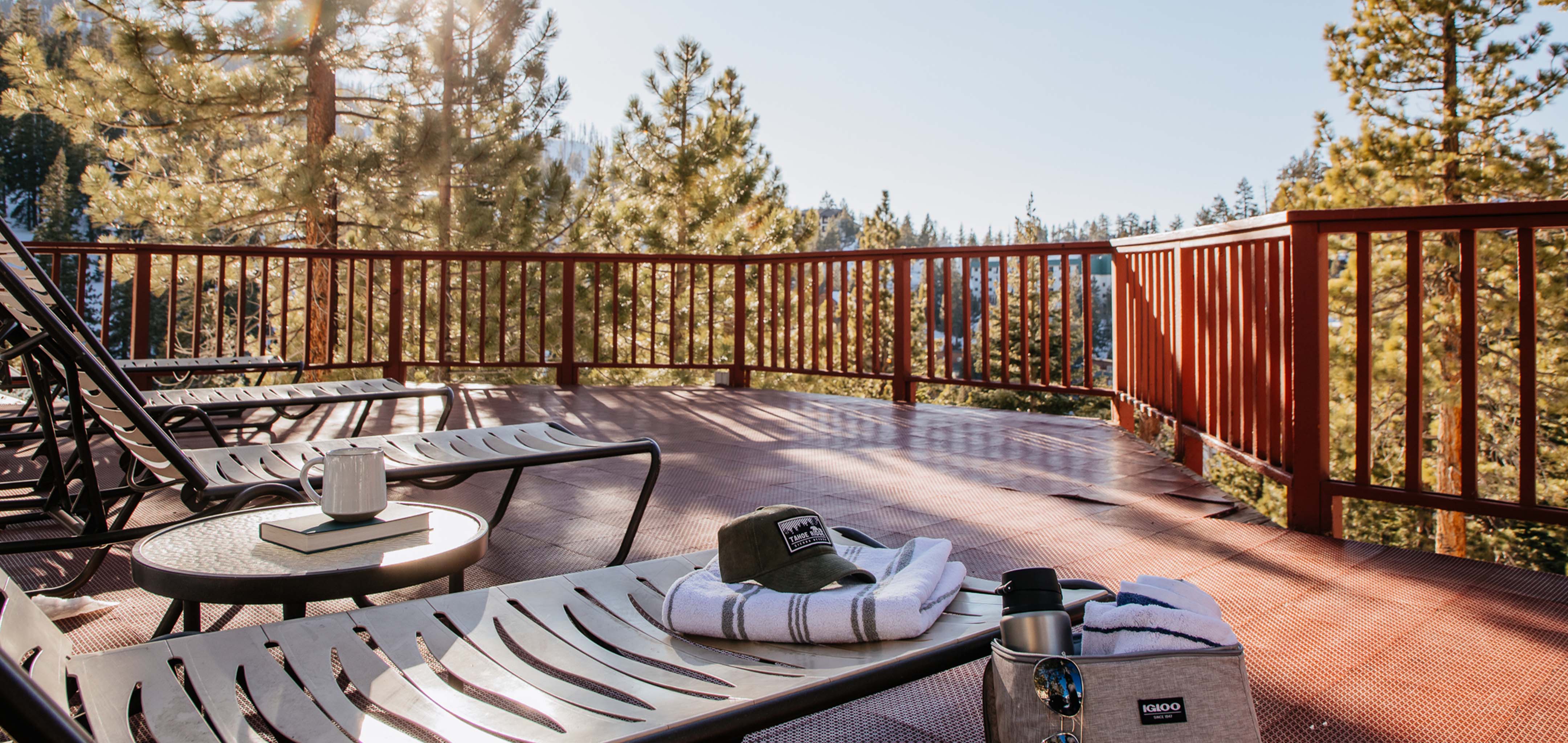 Balcony with pool chairs looking onto mountains at Tahoe Ridge Resort in Stateline, Nevada.