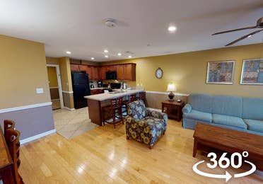 Living room and kitchen in a three-bedroom Ambassador villa at Galveston Seaside Resort in Galveston, Texas.