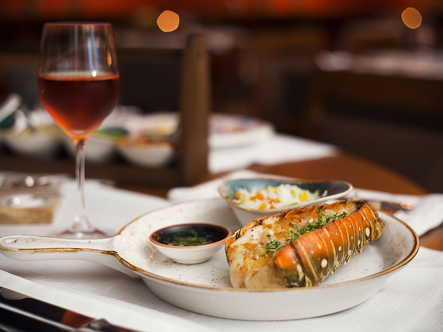 Food with a glass of wine at the Grand Residences Resort in Puerto Morelos, Mexico