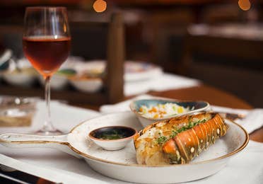 Food with a glass of wine at the Grand Residences Resort in Puerto Morelos, Mexico