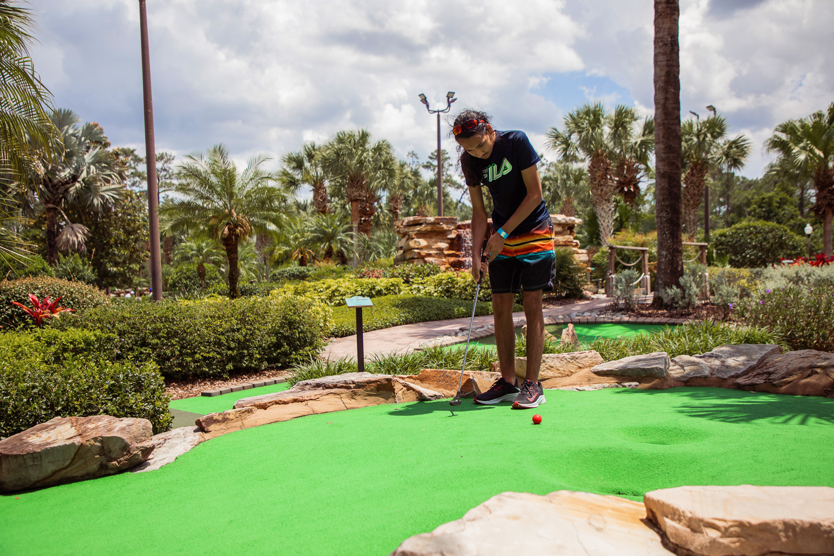 Special Olympic Athlete, Roan Luallen plays a round of mini golf at our Orange Lake Resort located in Orlando, Florida.