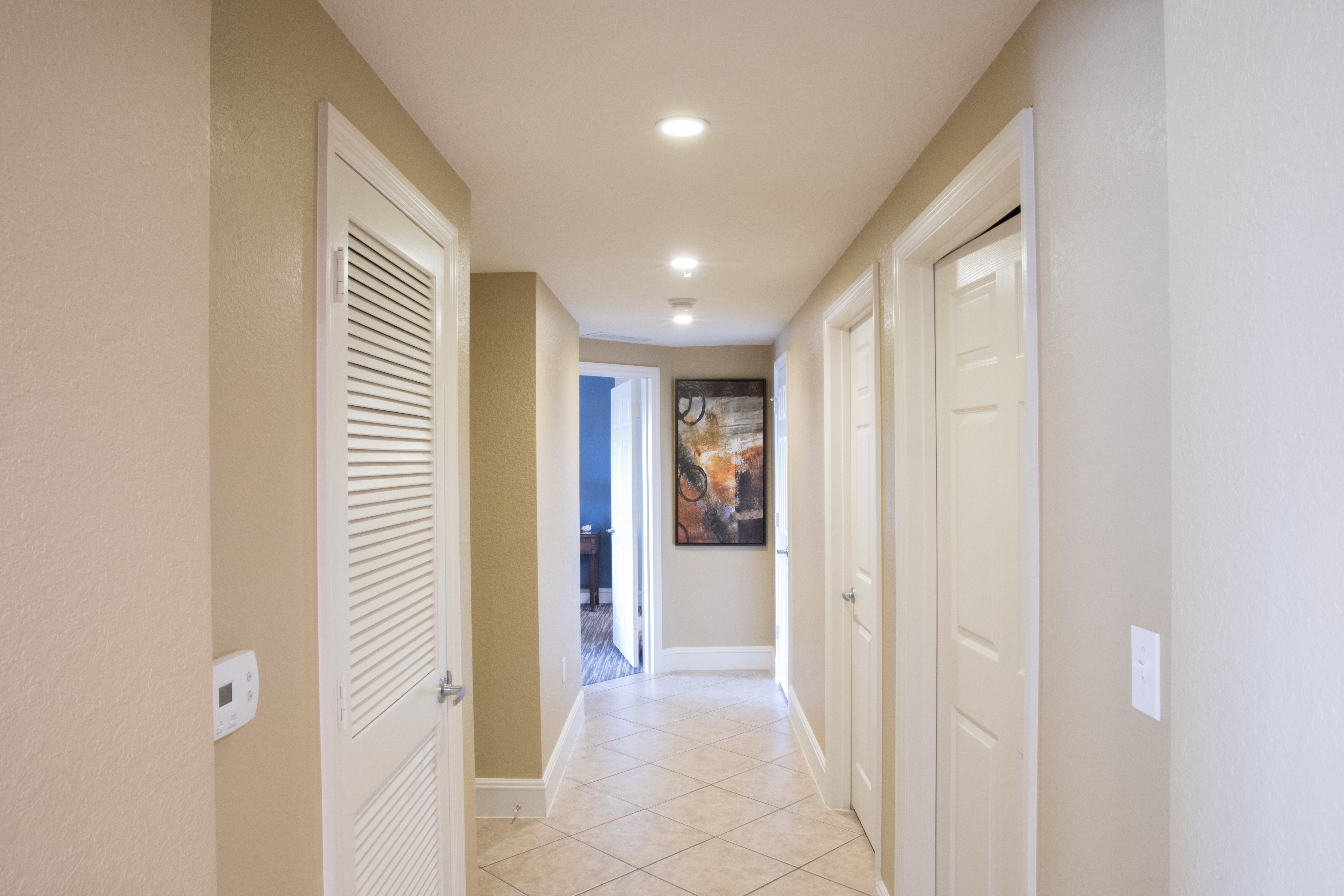 Hallway leading to bedrooms in a four bedroom Signature villa in River Island at Orange Lake Resort near Orlando, Florida