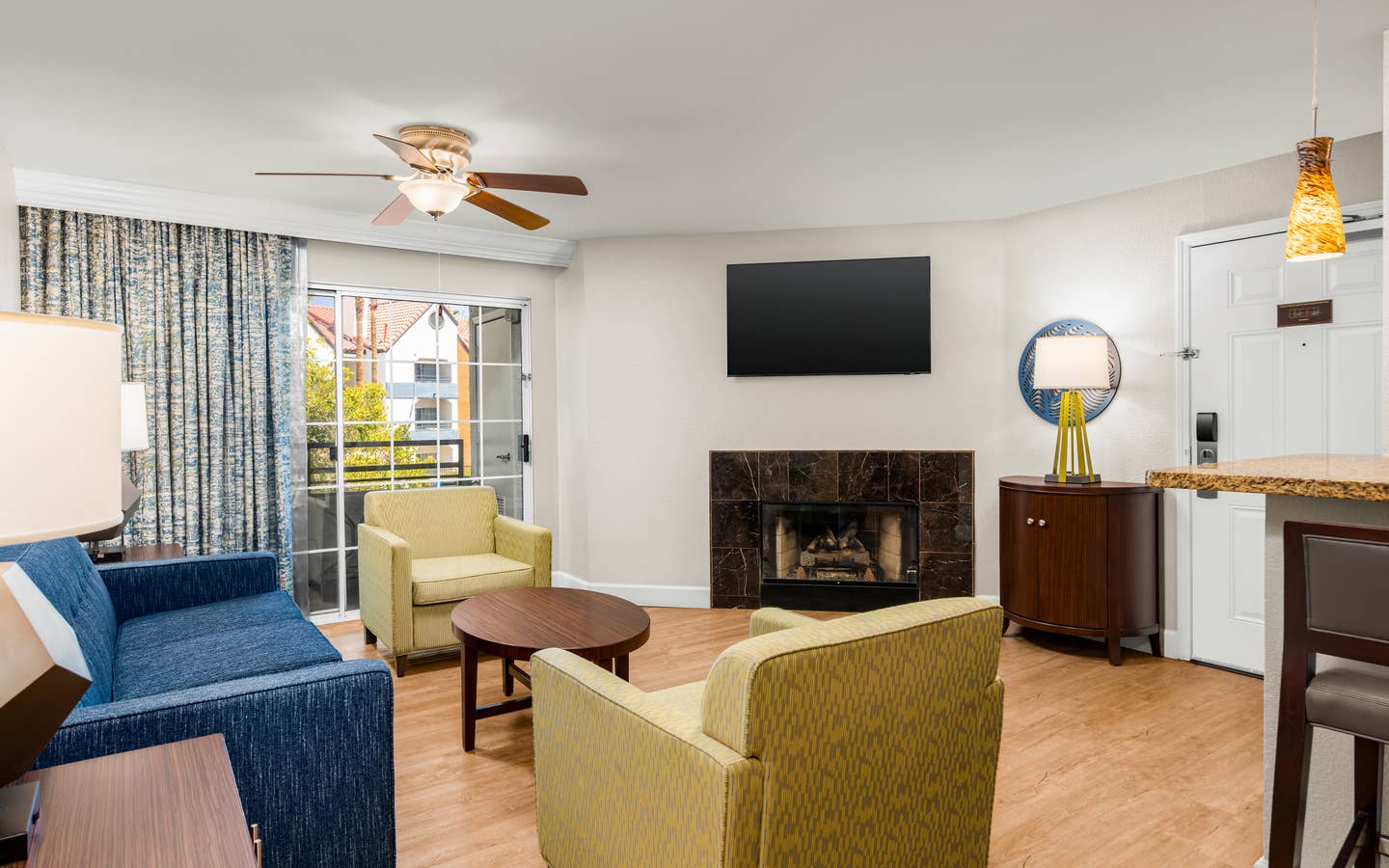 Elegant living area with modern furnishings and a cozy fireplace.