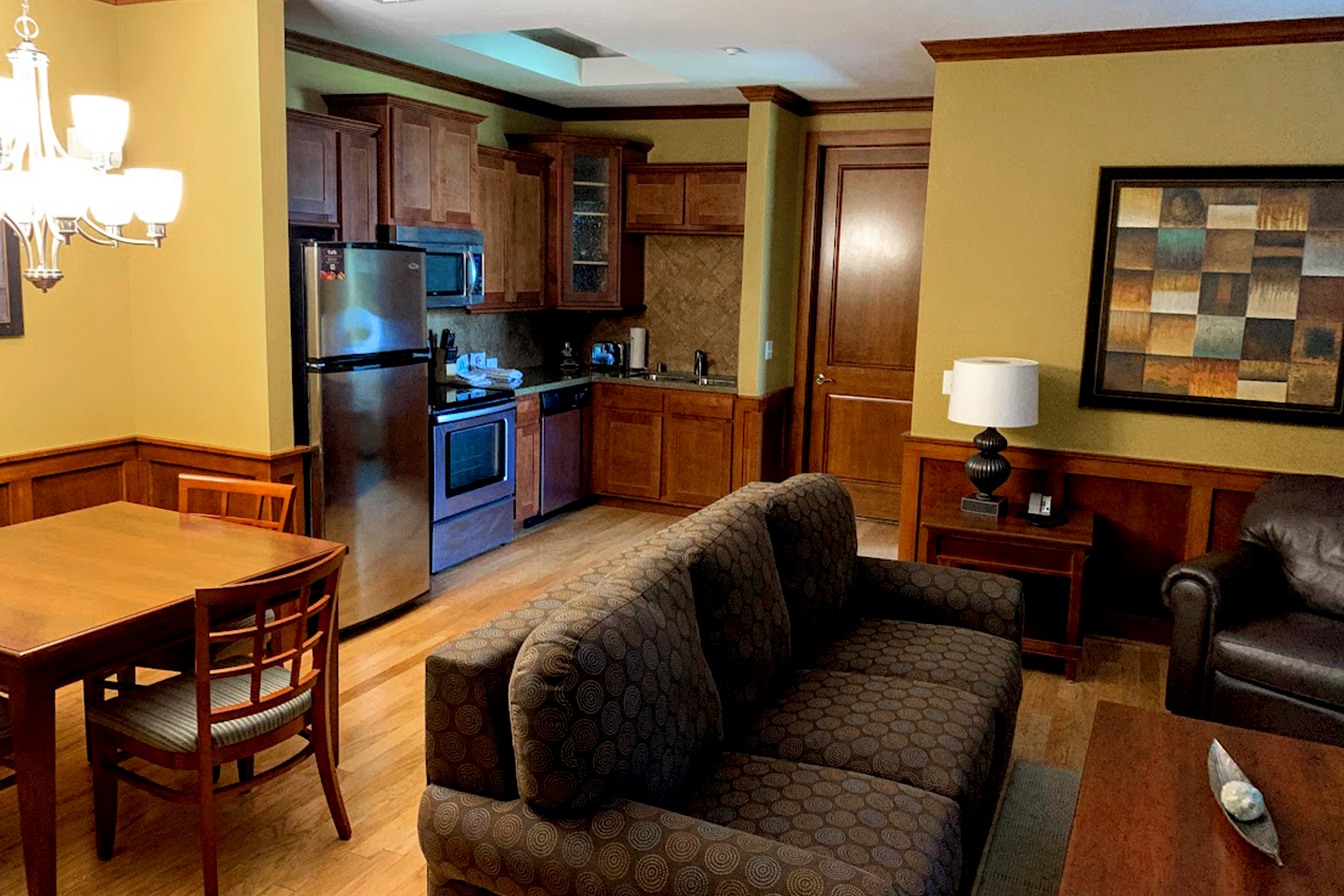 A villa with a kitchen, living room and dining table.