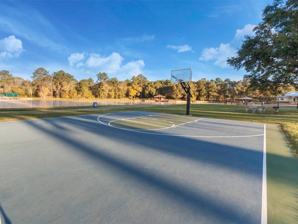 Outdoor basketball court at Piney Shores Resort in Conroe, Texas.