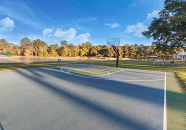 Outdoor basketball court at Piney Shores Resort in Conroe, Texas.
