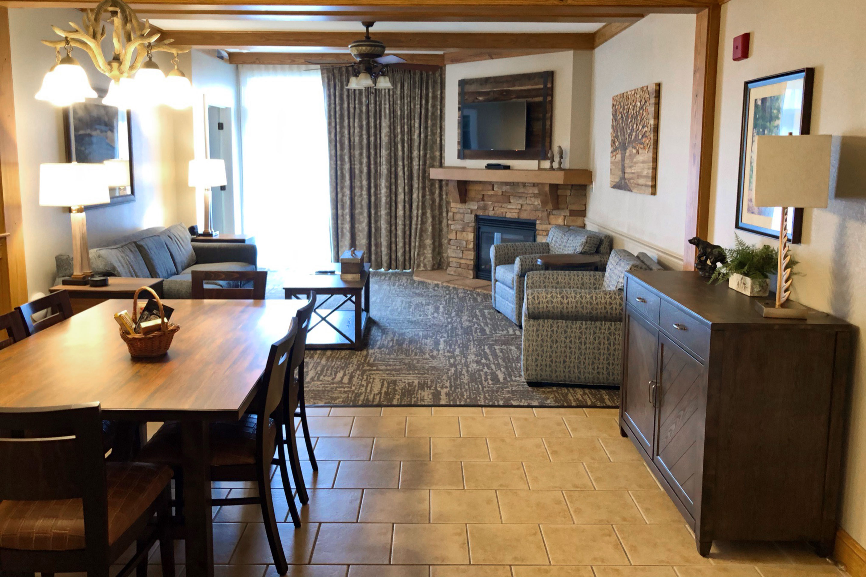 The dining table and living room in our two-bedroom villa at Smoky Mountain Resort.