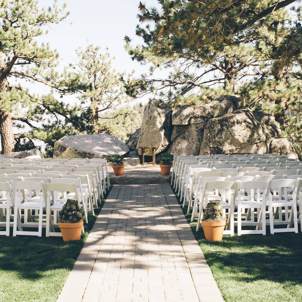 White chairs set up for a wedding ceremony