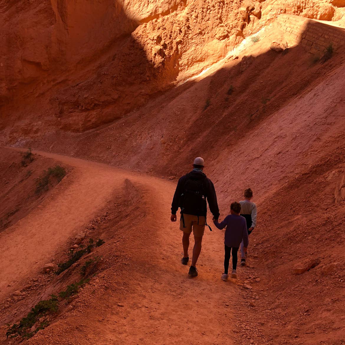 Josh (left) Kyndall and Kyler (right) walk amongst the red rock formation at Bryce Canyon.