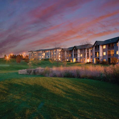 View of golf course and property buildings at Lake Geneva Resort