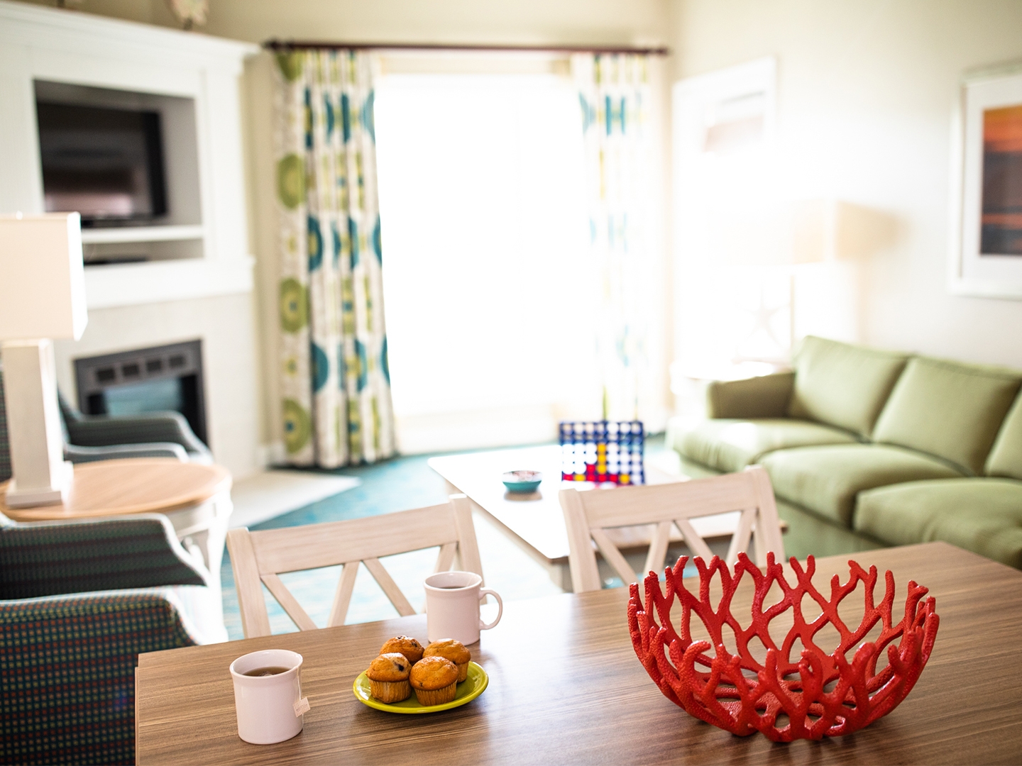 Living room with couch and flat screen TV in a two-bedroom villa at South Beach Resort in Myrtle Beach, South Carolina.