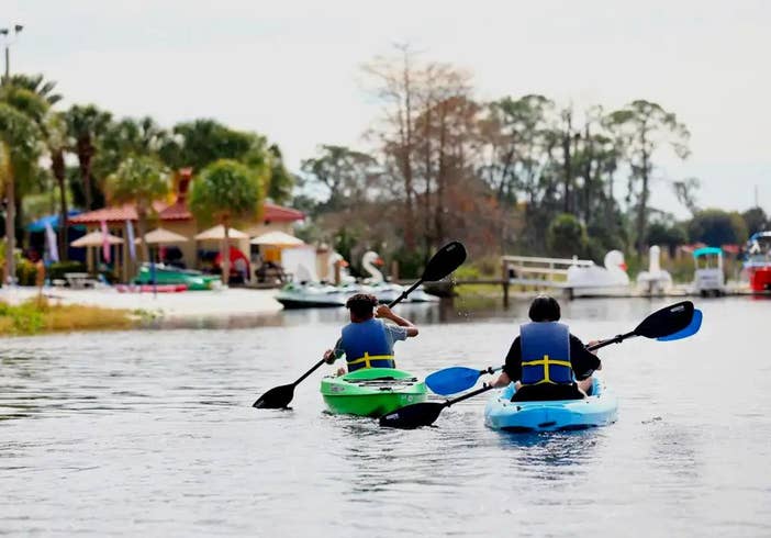 Watersports at Orange Lake Resort in Orlando, FL. Two boys kayaking at Orange Lake.
