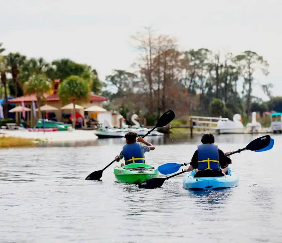 Watersports at Orange Lake Resort in Orlando, FL. Two boys kayaking at Orange Lake.