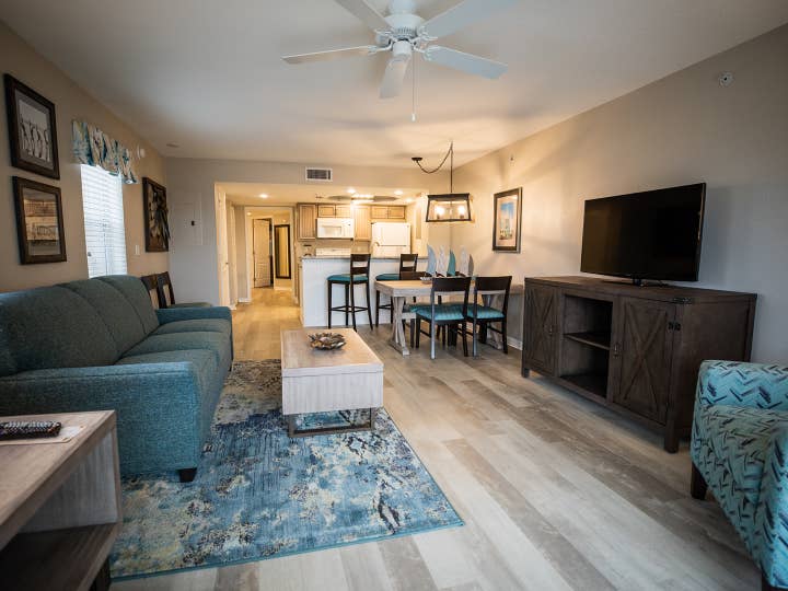 Open concept living, dining and kitchen area in a villa at Cape Canaveral Beach Resort.