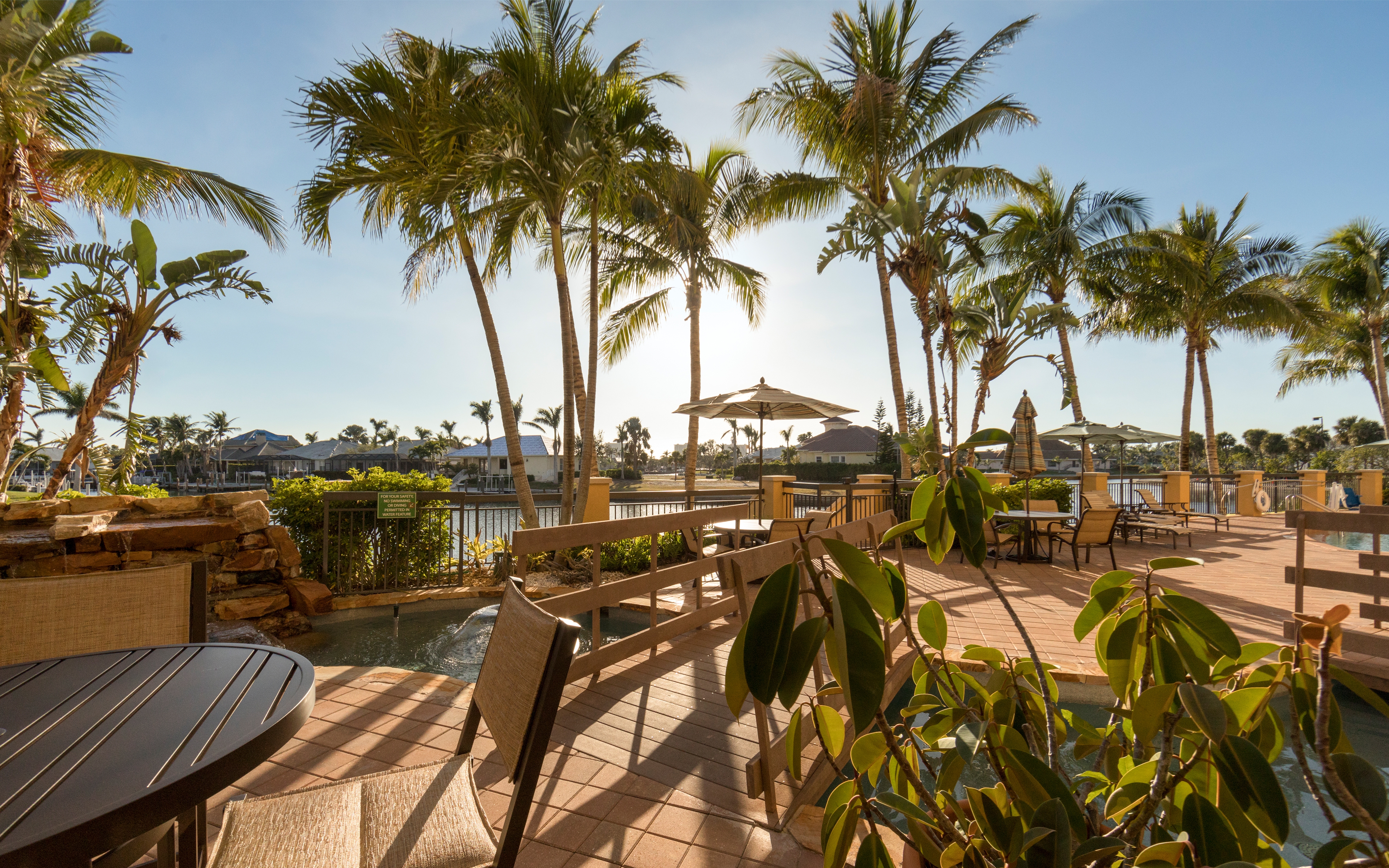 Seating next to the pool at Sunset Cove Resort