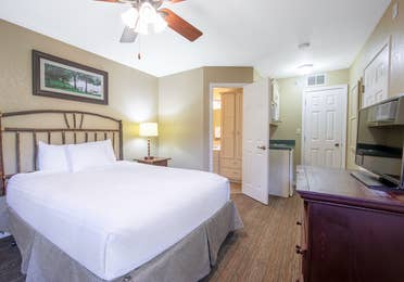 Bedroom in a two-bedroom lodge villa at Fox River Resort in Sheridan, Illinois.